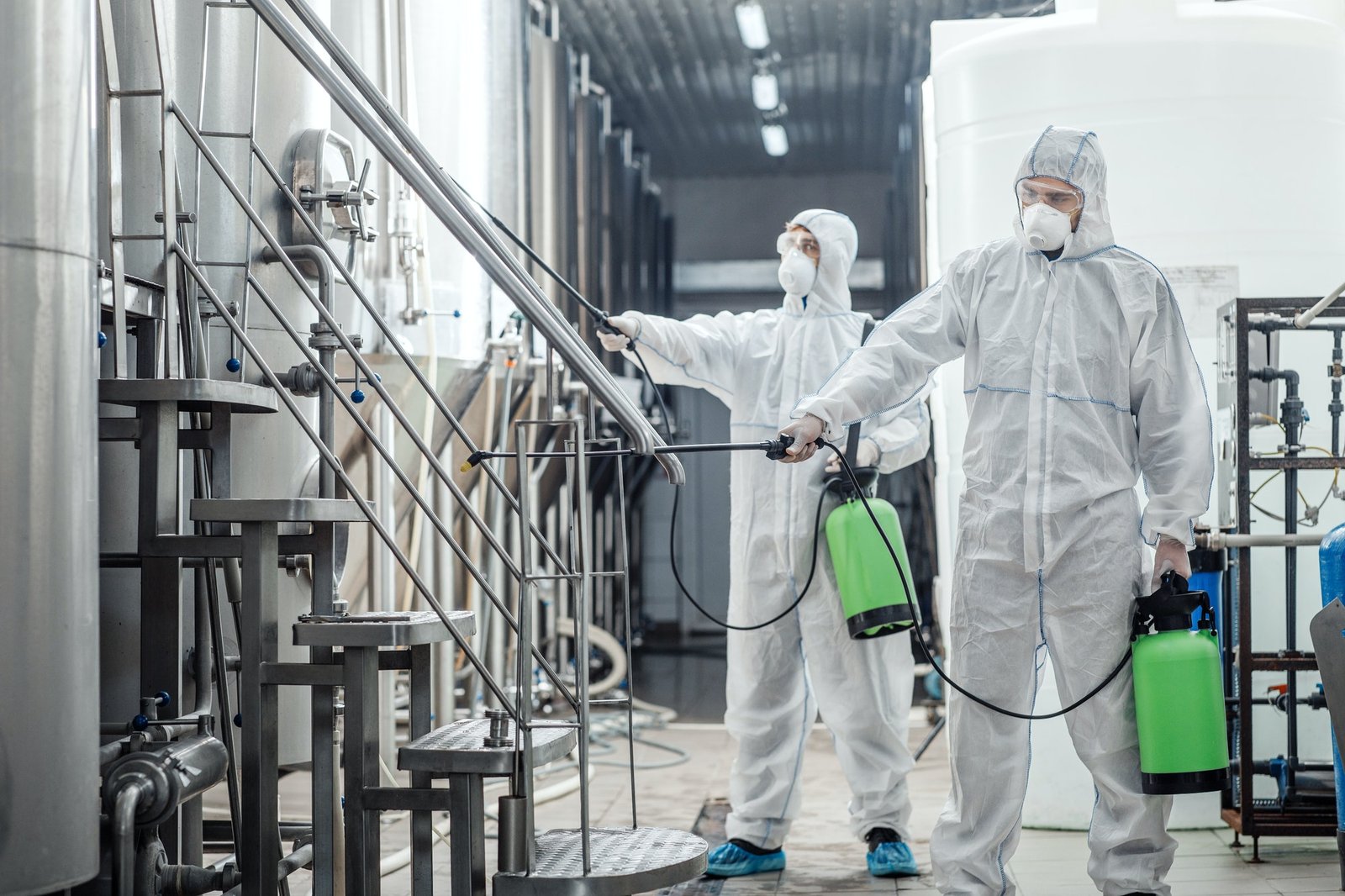 sanitation-at-factory-of-craft-beer-guys-in-protective-suits-disinfect-at-plant.jpg